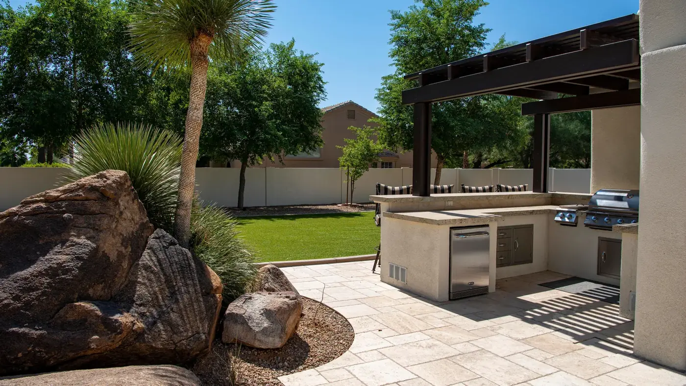 Illustrative stock photo of a residential outdoor kitchen, not a ClearBuild project